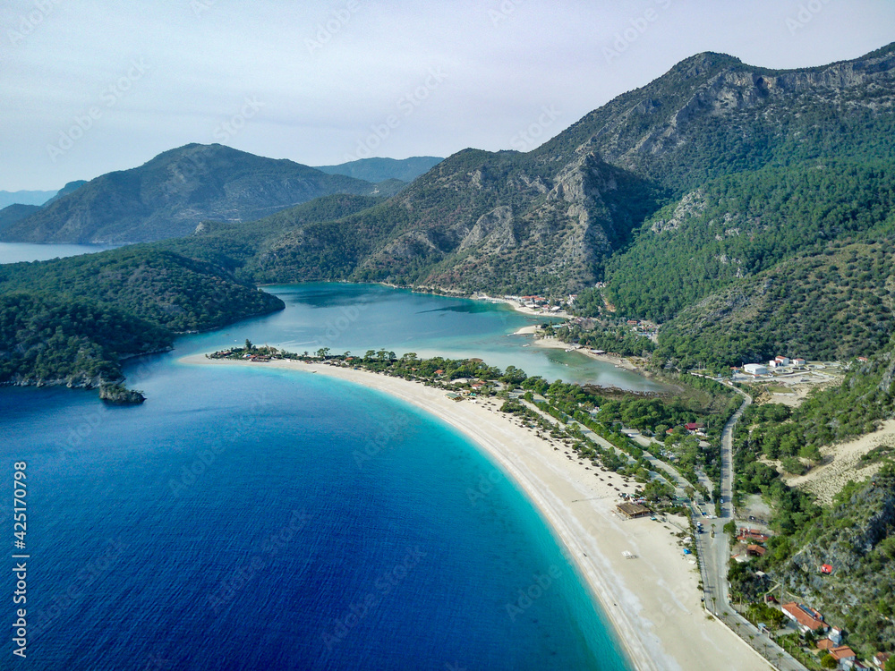 Amazing beautiful panoramic view from drone of natural park of Oludeniz and Fethiye blue lagoon and tranquil aquamarine dead sea.
