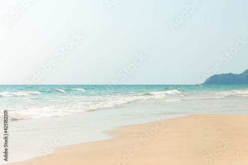 Tropical beach view Sea waves seamless loop on the beautiful sand beach.