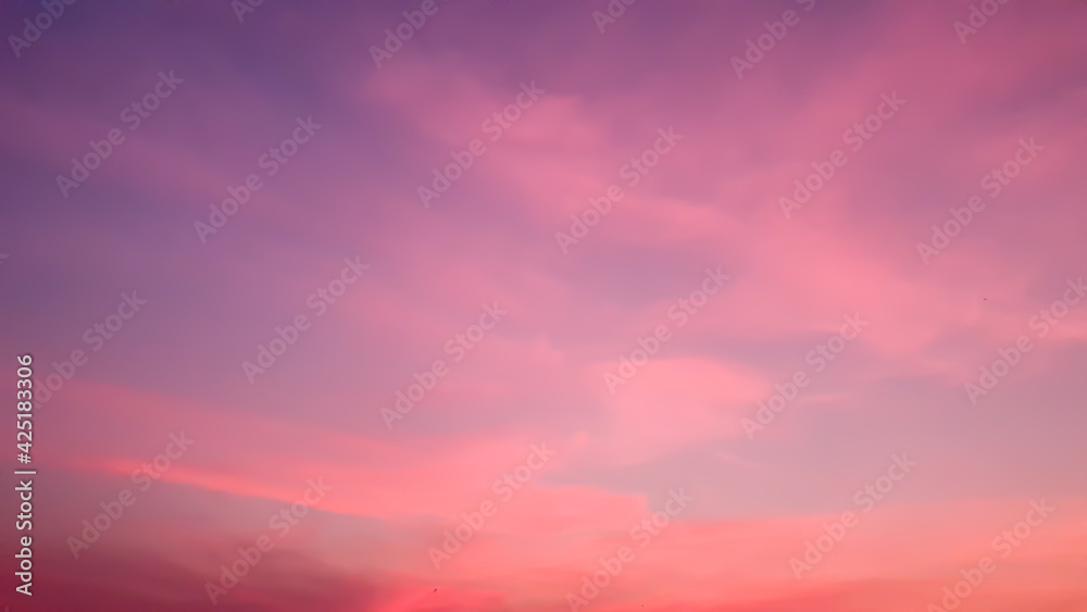 Abstract idyllic winter frosty orange and purple sky,background texture of colorful sunset. Twilight sky