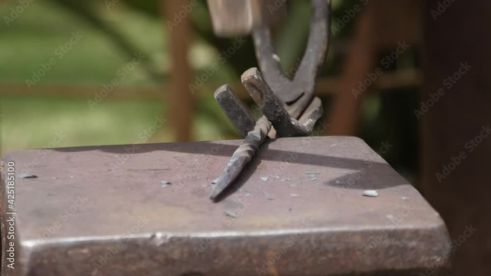 blacksmith hammering metal at medieval forge blacksmith hammering metal at medieval forge