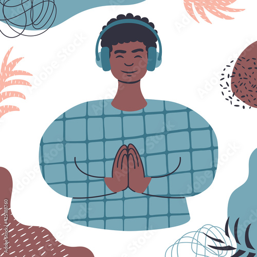 Audio guided meditation. Young african man relaxing in headphones.