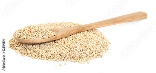 Wooden spoon and quinoa on white background