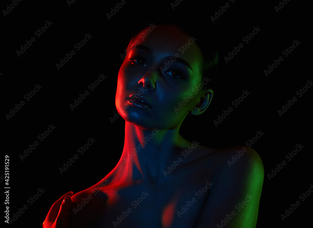 beauty young woman in colorful lights beauty young woman in colorful lights