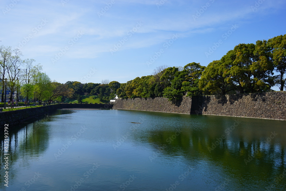 Tokyo, Japan - March 2021: Imperial palace moat (Sotobori) and stone wall (fortress) in Tokyo, Japan - 皇居 外濠 Tokyo, Japan - March 2021: Imperial palace moat (Sotobori) and stone wall (fortress) in Tokyo, Japan - 皇居 外濠