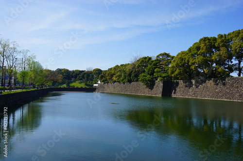 Tokyo, Japan - March 2021: Imperial palace moat (Sotobori) and stone wall (fortress) in Tokyo, Japan - 皇居 外濠