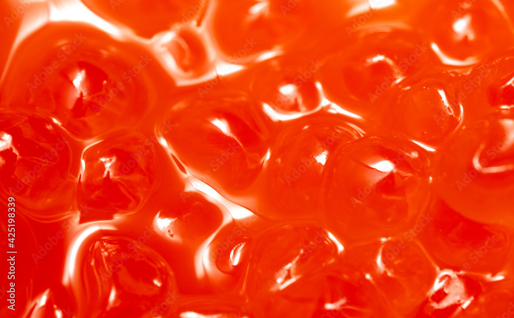 Close-up of red caviar as background.
