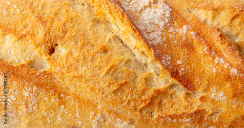 Fresh bread crust as background.