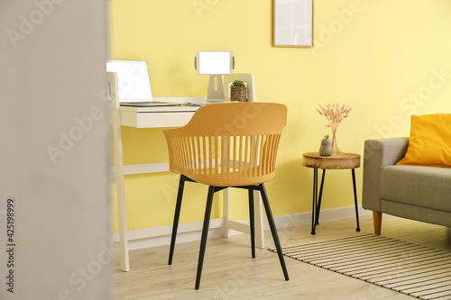 Stylish workplace with lapt...