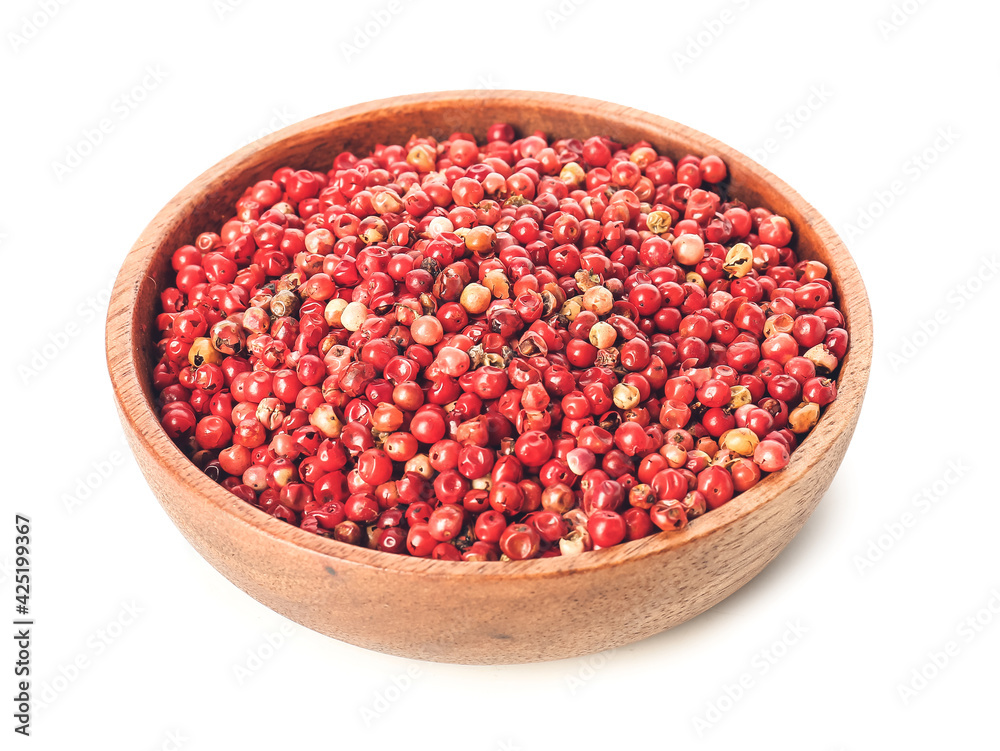 Bowl with red peppercorns on white background Bowl with red peppercorns on white background