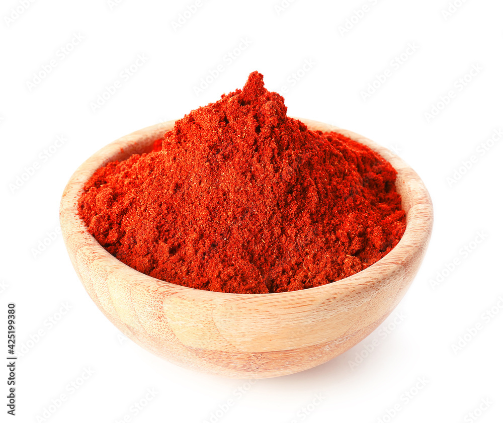 Bowl with red chili powder on white background Bowl with red chili powder on white background