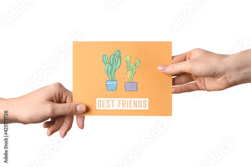 Female hands holding greeti...