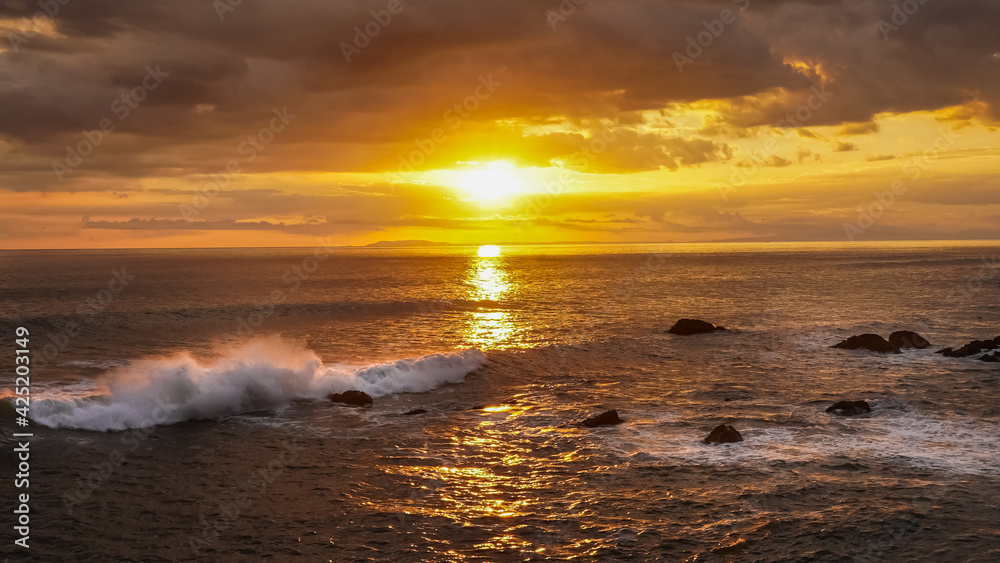 Beautiful colors of a sunset in the pacific ocean in the magical beaches of Costa Rica Beautiful colors of a sunset in the pacific ocean in the magical beaches of Costa Rica