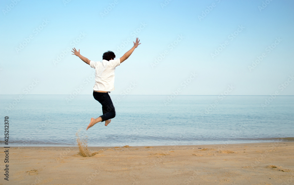 flying jump man to ocean in holiday wih copy space flying jump man to ocean in holiday wih copy space