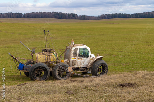 Street lighting. special machine on wheels for gentle spraying of crops in the field. Filled with fertilizer for plants.