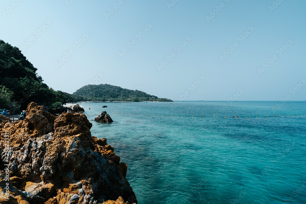 beautiful soft wave clear blue transparency sea ocean water and rocks at the bottom of the tropical paradise beach coast summer sea view at koh kham Samae SanIsland, Sattahip, Chonburi, Thailand beautiful soft wave clear blue transparency sea ocean water and rocks at the bottom of the tropical paradise beach coast summer sea view at koh kham Samae SanIsland, Sattahip, Chonburi, Thailand
