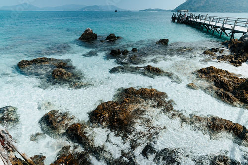 beautiful soft wave clear blue transparency sea ocean water and rocks at the bottom of the tropical paradise beach coast summer sea view at koh kham Samae SanIsland, Sattahip, Chonburi, Thailand