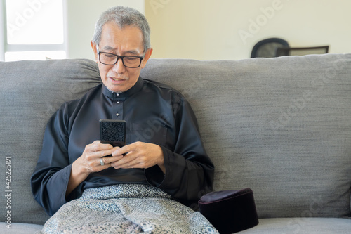 Eid Mubarak celebration moment with Malay senior photo