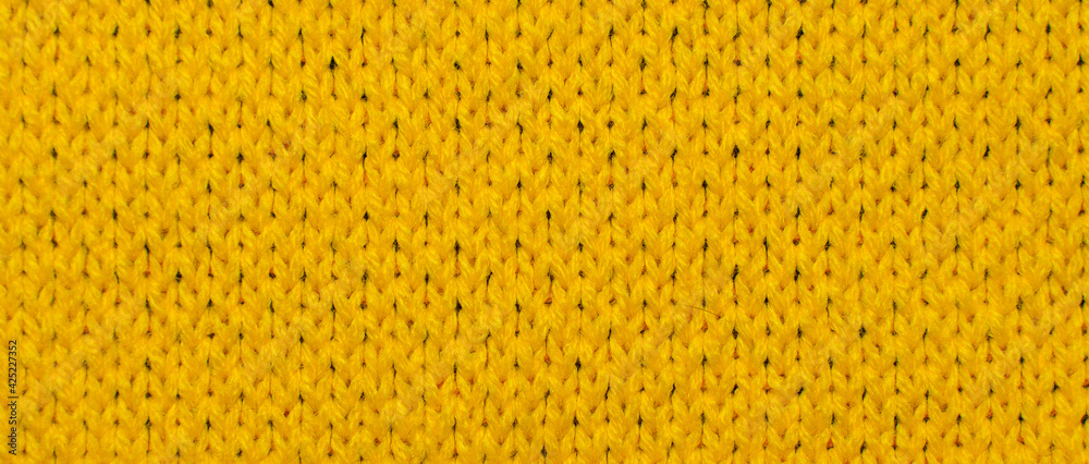 Yellow synthetic knitted fabric texture Yellow synthetic knitted fabric texture