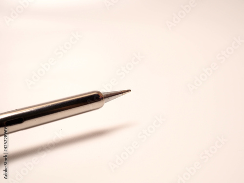 Close up shoot of soldering iron, a tool for soldering electrical components. Shoot on white isolated background