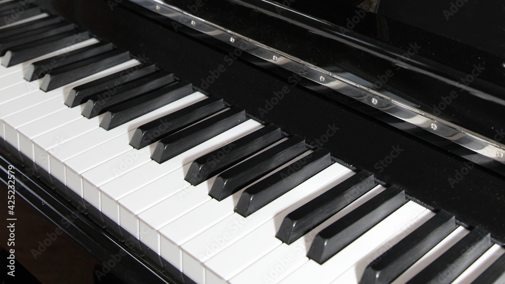 Classic black Piano keyboard close up diagonal top view, classical music background Classic black Piano keyboard close up diagonal top view, classical music background