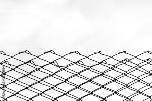 Minimalistic chain metal fence on a light background.