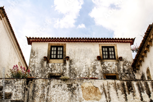 Narrow and colorful streets, facades and balconies of Obidos