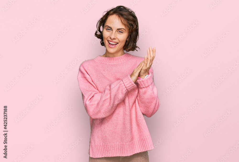 Young hispanic woman wearing casual clothes clapping and applauding happy and joyful, smiling proud hands together Young hispanic woman wearing casual clothes clapping and applauding happy and joyful, smiling proud hands together