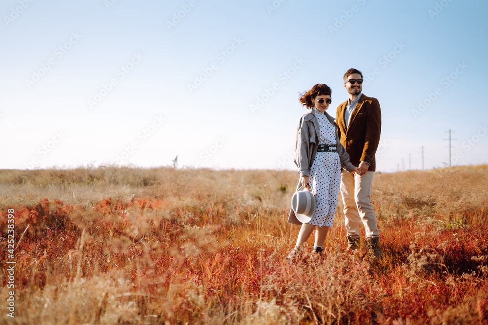 Stylish and loving couple enjoying each other outdoors. Enjoying time together. The concept of youth, love and lifestyle. Springtime. Stylish and loving couple enjoying each other outdoors. Enjoying time together. The concept of youth, love and lifestyle. Springtime.