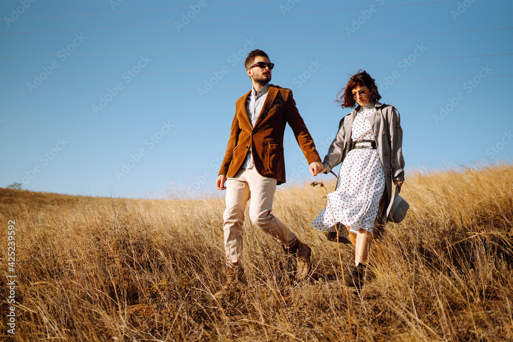 Stylish and loving couple enjoying each other outdoors. Enjoying time together. The concept of youth, love and lifestyle. Springtime. Stylish and loving couple enjoying each other outdoors. Enjoying time together. The concept of youth, love and lifestyle. Springtime.