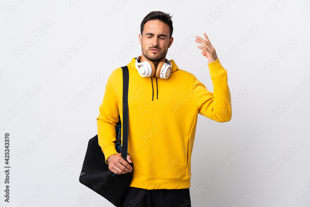 Young sport man with sport bag isolated on white background with tired and sick expression Young sport man with sport bag isolated on white background with tired and sick expression