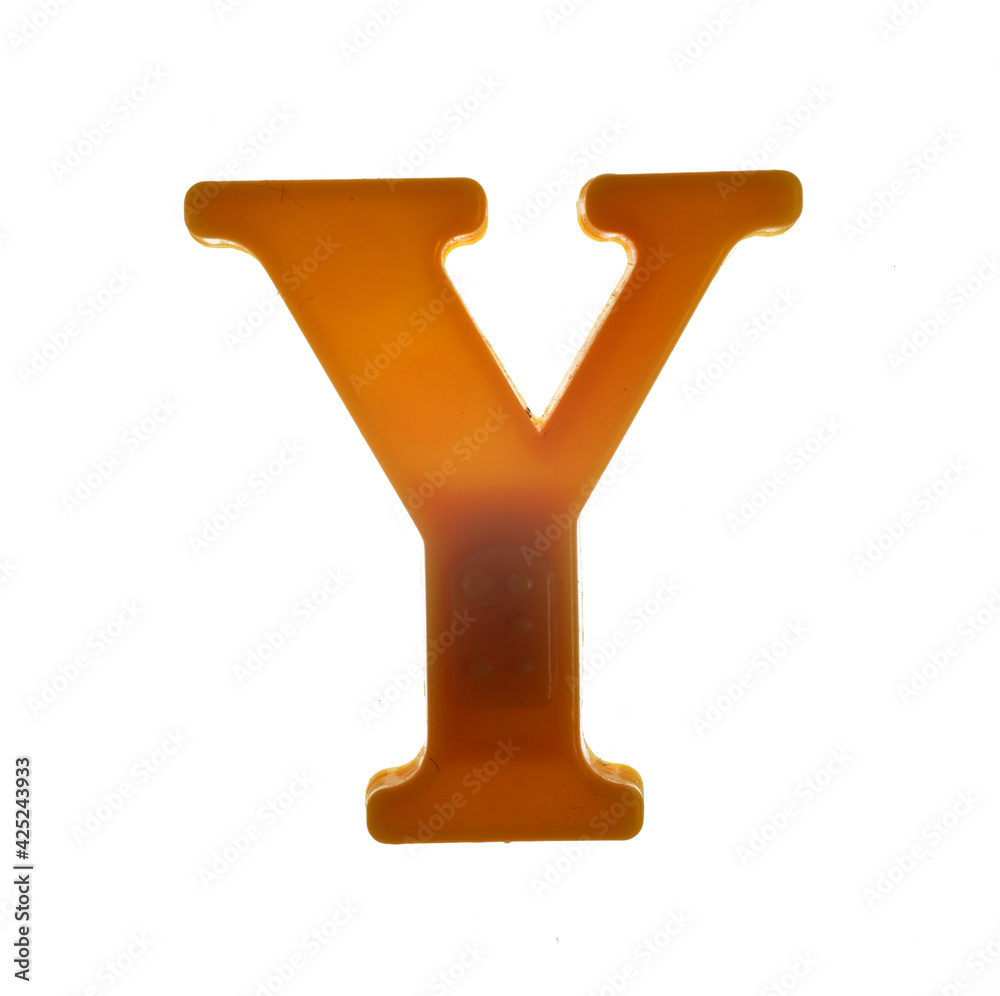 Plastic letter Y on magnet isolated on white background, top view Plastic letter Y on magnet isolated on white background, top view