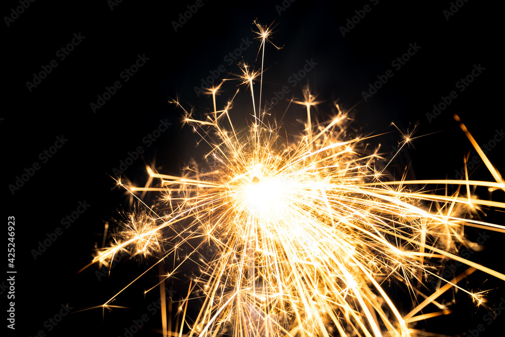 Sparkler burning with dark background. Abstract fire burning background