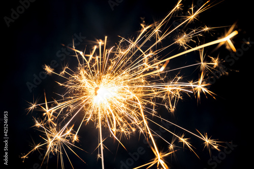 Sparkler burning with dark background. Abstract fire burning background