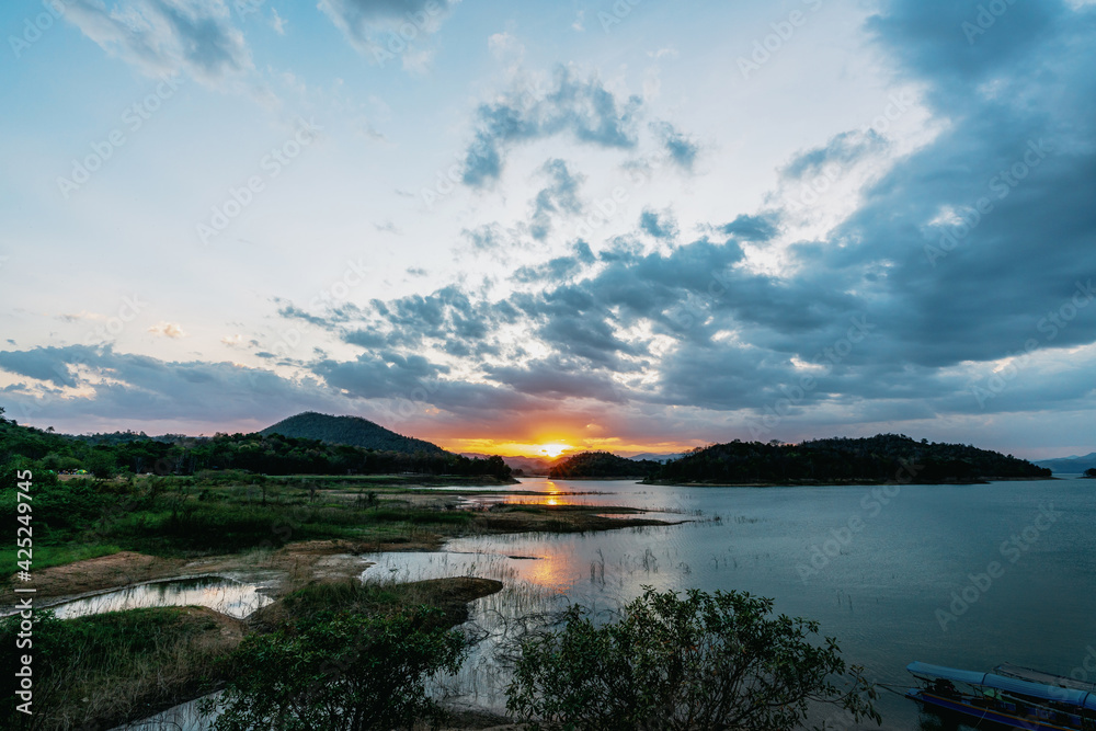 Obraz premium beautiful blue sky lake view high peak jungle mountains green river forest at Kaeng Krachan dam National Park, Phetchaburi, Thailand.