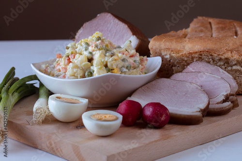 Traditional croatian Easter dish: Oliviers salad with cooked smoked ham, radish, horsheradish, eggs and young onion. .Part od meal   are blessed in church  for Easter breakfast. photo