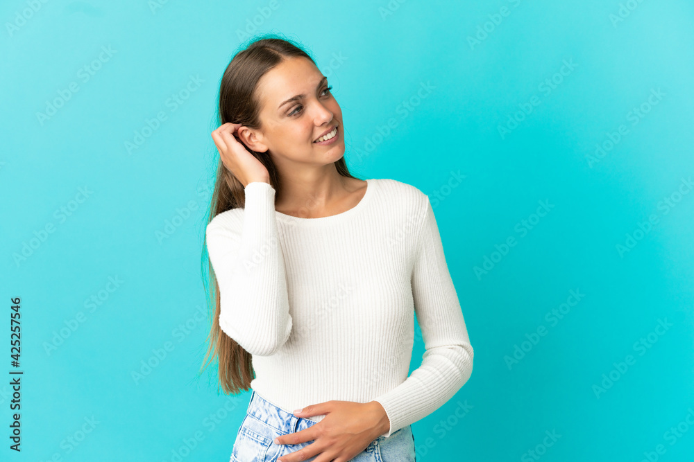 Young woman over isolated blue background thinking an idea Young woman over isolated blue background thinking an idea