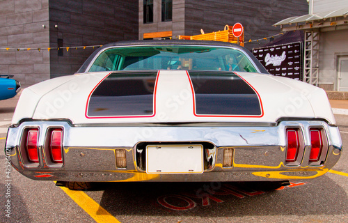 Classical American vintage car 1970. Back view.