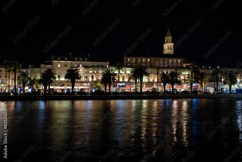 Old town of Split by night, Dalmatia, Croatia. Panorama. Palace of Diocletian, Riva promenade, Bell tower and Cathedral of Saint Domnius. 
