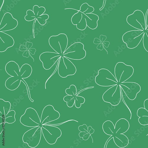 Seamless pattern with clover. The leaves of the clover. Contour background. White line. The green pattern. Vector illustration. Stock vector. © Алина Ермохина