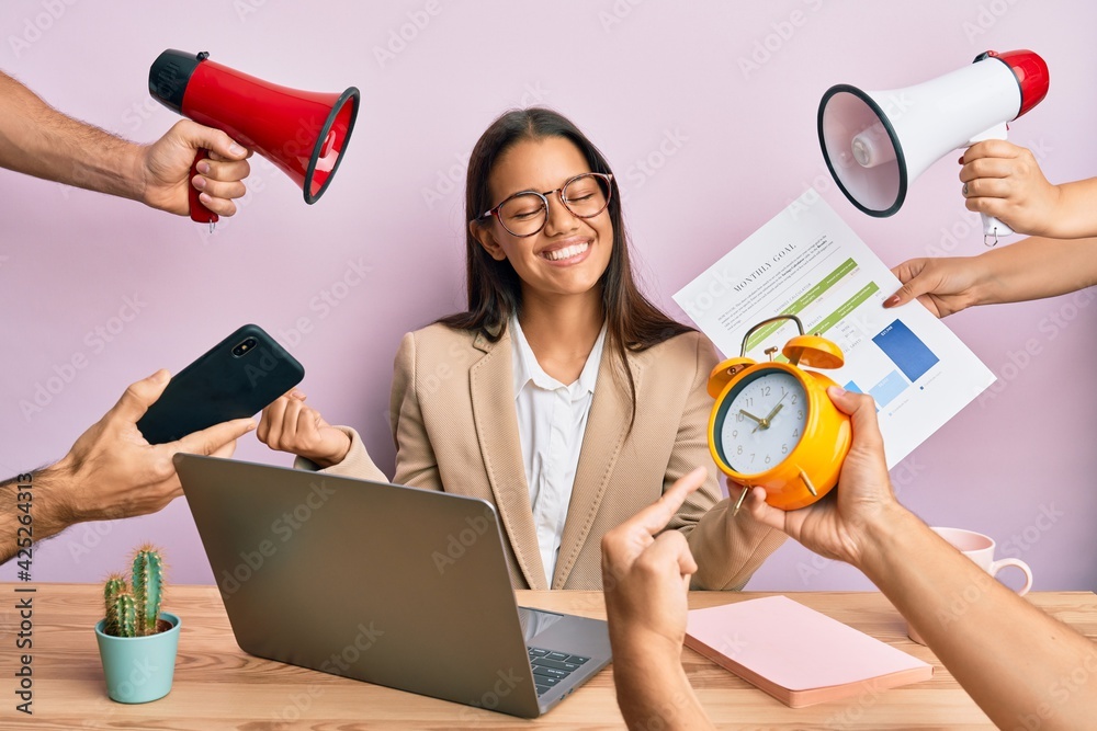 Beautiful hispanic woman working at the office under stress very happy and excited doing winner gesture with arms raised, smiling and screaming for success. celebration concept. Beautiful hispanic woman working at the office under stress very happy and excited doing winner gesture with arms raised, smiling and screaming for success. celebration concept.