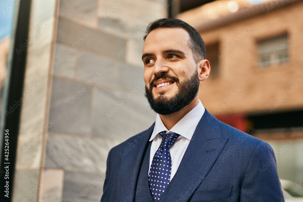 Young businessman smiling happy standing at the city. Young businessman smiling happy standing at the city.