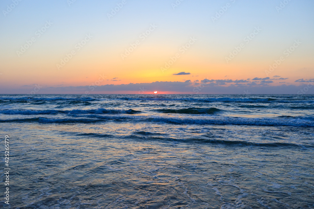 The amazing sunset on the sea at Tel Aviv Tzuk beach