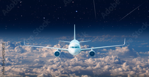 Passenger airplane in the sky with many stars "Elements of this image furnished by NASA"