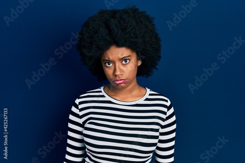 Young african american woman wearing casual clothes skeptic and nervous, frowning upset because of problem. negative person.