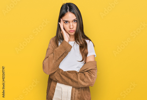 Young brunette woman wearing casual clothes thinking looking tired and bored with depression problems with crossed arms. © Krakenimages.com