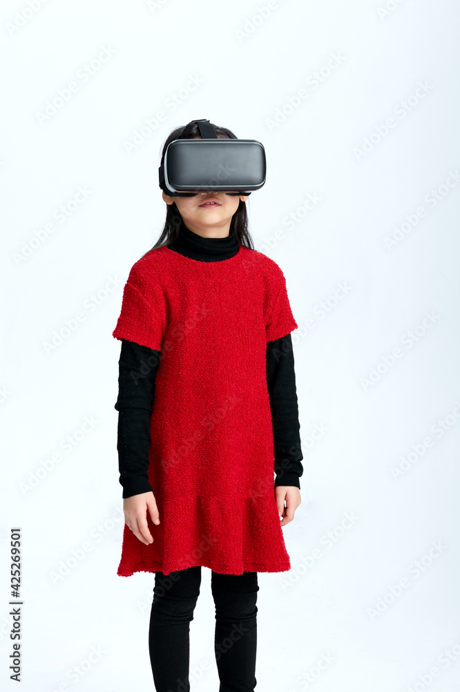 Cute Asian little girl playing with VR glasses Cute Asian little girl playing with VR glasses