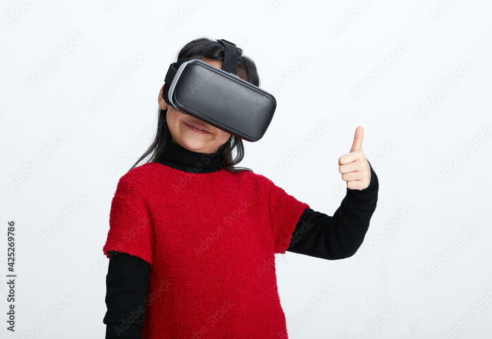 Cute Asian little girl playing with VR glasses Cute Asian little girl playing with VR glasses