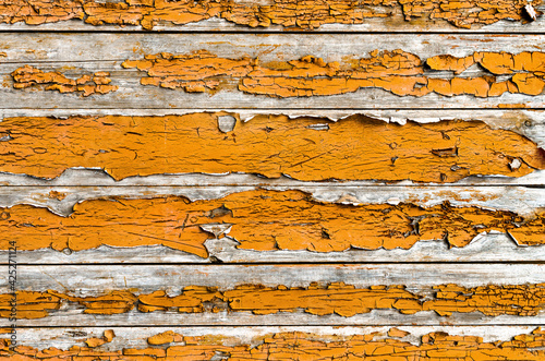 orange wood background with peeled paint