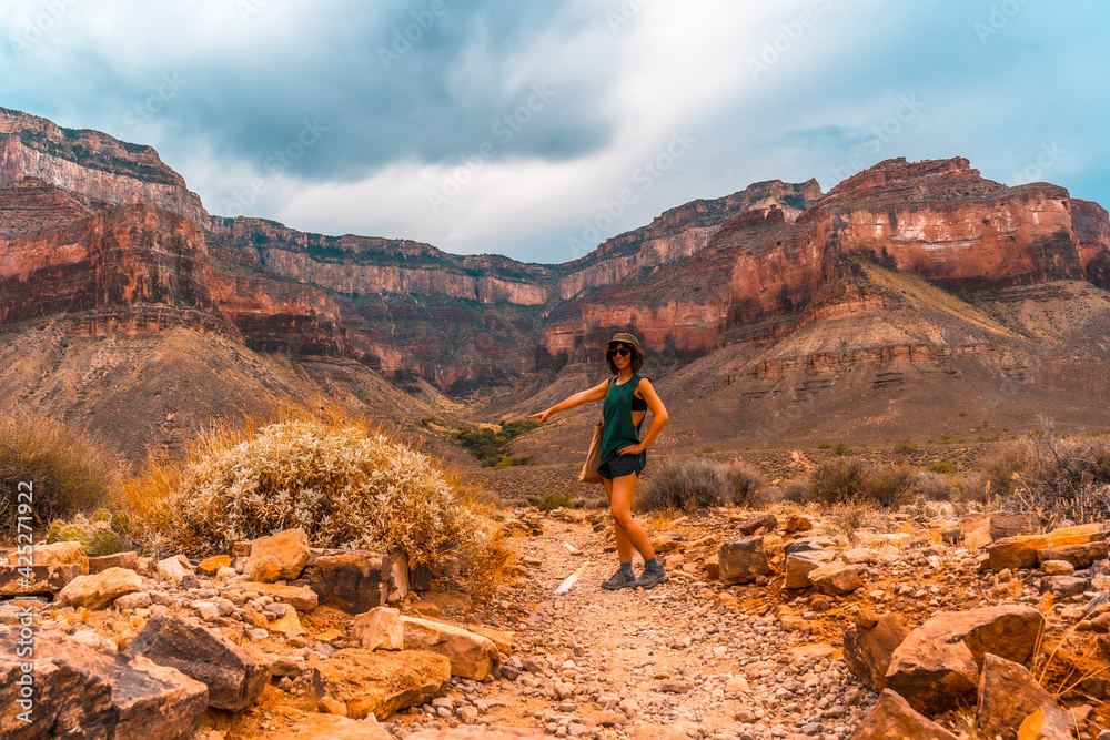 A young woman walking along the Bright Angel Trailhead at the Tonto West turnoff, in the Grand Canyon. Arizona.