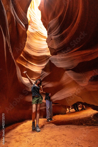 A young woman on the Upper Antelope Canyon trail in the city of Page, Arizona. USA